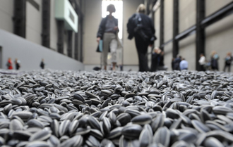 Sunflower seeds,  by Ai WeiWei , 100 million painted porcelain seeds, 2008-2010, © Ai WeiWei, Tate Modern, London