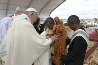 Pope blesses a statue. Image: Vatican Media
