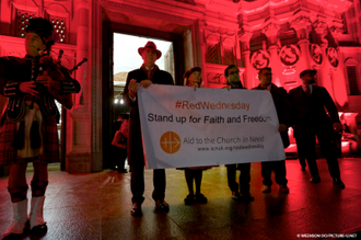 Rehman Chishti, Baroness Nicholson and Neville Kyrke-Smith with #RedWednesday banner. Image: Weenson OO/PICTURE-U.NET