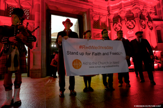 Rehman Chishti, Baroness Nicholson and Neville Kyrke-Smith with #RedWednesday banner. Image:  Weenson OO/PICTURE-U.NET