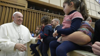 Pope greets Vatican employees with their famileis