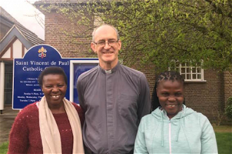 Scholastica and Lenny with parish priest Fr Mark Leenane at St Vincent de Paul's, Osterley