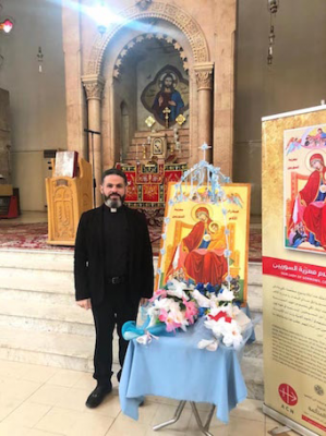 Fr Charbel Eid Rizkallah with icon of Our Lady of Sorrows