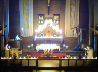 Fr Pat sings the Exultat during the Easter Vigil