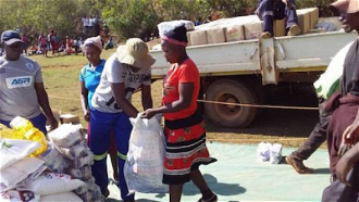Cooking oil, maize meal, salt, rice and beans being distributed in Mutare, Zimbabwe.