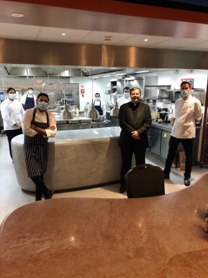 Anshu Anghotra (left) with some of the Connaught kitchen staff who prepare 600 meals a day for the homeless, with Fr Dominic Robinson (centre)
