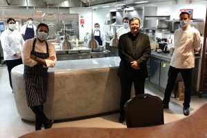 Anshu Anghotra (left) with some of the Connaught kitchen staff who prepare 600 meals a day for the homeless, with Fr Dominic Robinson (centre)