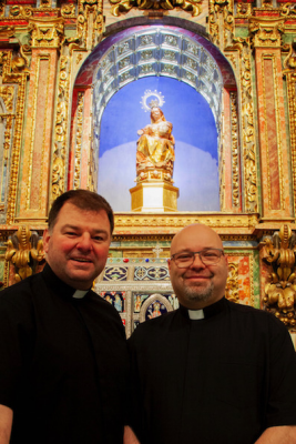 Rector Canon Paul Farrer and vice-rector Fr Damian Cassidy O.Carm. beneath 400-year-old statue of Our Lady Vulnerata.