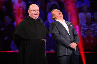 Fr George  with show host Bradley Walsh. Picture copyright ITV/Matt Frost/Shutterstock.