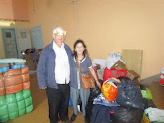 Ben and Marie-Claude Bano with goods for 'Secours Catholique' Calais warehouse