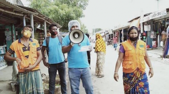 Church aid network volunteers & staff delivered early warning messages as Cyclone Amphan approached. Photo: Caritas Bangladesh