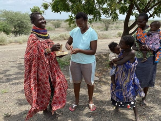 Mother receives Solar Charger  that  will help earn the income to feed herself and her twins.