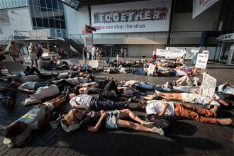 Die-in protrest outside 2018 International AIDS Conference, Amsterdam, July 2018, against Philippine President's deadly war on drug users  Photo:Albin Hillert/WCC