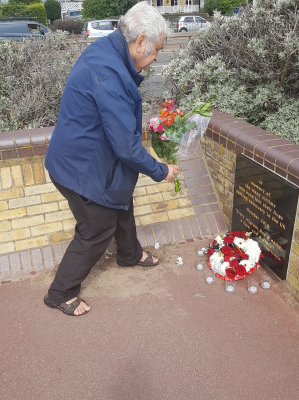 Ben Bano laying flowers  at the memorial on Dover seafront