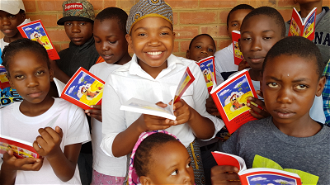 ACN's Child Bible being read by children in Zimbabwe: © Aid to the Church in Need