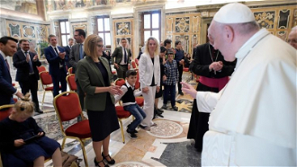 Pope meets the Sunshine children with their parents and teachers