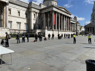 Homeless queue for food outside National Gallery