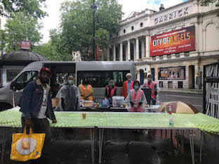 Volunteers serving refreshments in front of the Garrick Theatre - home to City of Angels