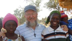 Fr Maccalli with parishioners in 2017