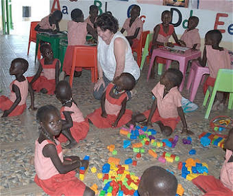Getting down with the kids, New Ways CEO Angela Docherty at Todonyang Nursery School