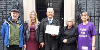 Bruce Kent (centre) and Theresa Alessandro (right) joined a group taking a petition to No10 in Sept 2019 calling UK government to sign the treaty