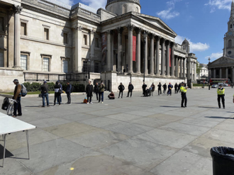 Homeless queue for food outside National Gallery  in Trafalgar Square during first Covid lockdown