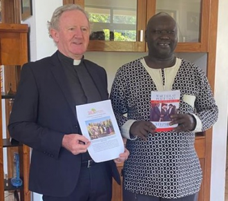 Fr Patrick Devine with Government Minister of Peacebuilding Stephen Par Kuol