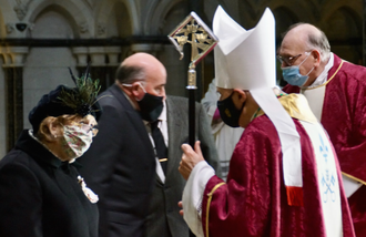 Bishop Alan Hopes talks with Lady Dannatt at Cathedral Mass in Norwich.