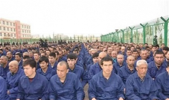 Uighar prisoners in Xinjiang Re-education Camp Lop County 2018 - Wiki image