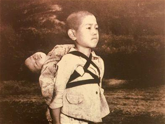 'The fruits of war.' Pope Francis prayer card for World Day of Prayer for Peace 2017. Photo by Joseph Roger O'Donnell, shows young Japanese boy waiting at crematorium with his dead younger brother on his back. Source: Vatican Media