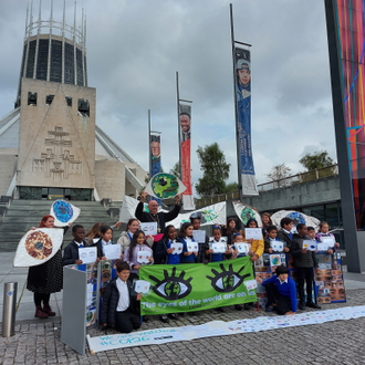 Archbishop Malcolm with St Nicholas pupils outside Liverpool Metropolitan Cathedral