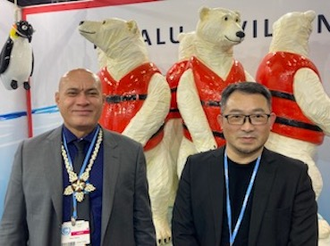 Tuvalu's finance minister Seve Paeniu with artist Vincent JF Huang at the Tuvalu Pavilion in COP26