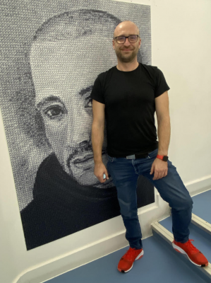 Manager Paweł Zabielski with image of founder Saint John of God