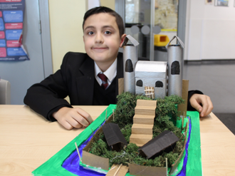 Young architect with his model castle - see ICN's Facebook page for more pictures.