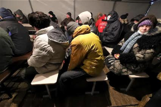 Homeless huddled in Depaul Ukraine tent