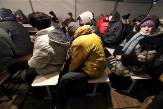 Homeless huddled in Depaul Ukraine tent