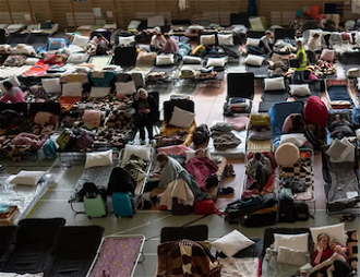 Hundreds of refugees shelter in Polish church hall