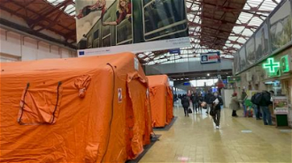Tents serve as temporary shelters for refugees at Bucharest Railway Station