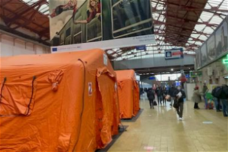 Tents serve as temporary shelters for refugees at Bucharest Railway Station