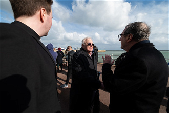 Phil Kerton meets Archbishop  Gugerotti by seafront plaques dedicated to migrants lost in Channel.  Image Mazur/CBCEW.org.uk