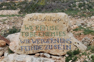 Inscription reads: WE REFUSE TO BE ENEMIES - Photo: Emma Halgren/WCC