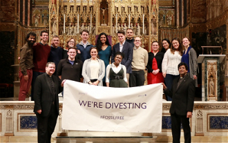 Young adults celebrate Jesuits in Britain divestment from fossil fuel companies. Photo credit: Bokani Tshidzu