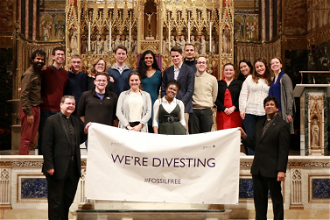 Young adults celebrate Jesuits in Britain divestment from fossil fuel companies. Photo credit: Bokani Tshidzu