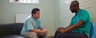 Pact support worker chats to family during an extended family visit. Image: Andy Aitchison.