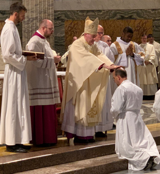 Laying on of Hands by Bishop Davies to Patrick on Wednesday during the Rite of Ordination to the Diaconate