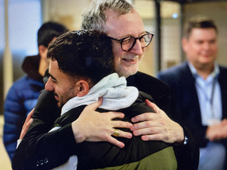 Nuncio, Archbishop Gugerotti greets refugee at Napier Barracks. Image: Mazur/CBCEW.org.uk