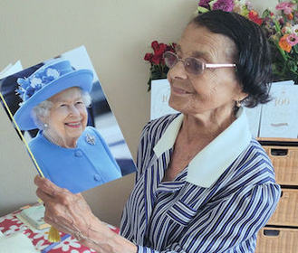 Olga with her card from the Queen