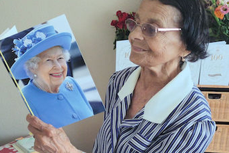 Olga with her card from the Queen
