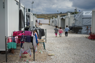 Photo by Julie Ricard on Unsplash. Syrian refugee camp near Athens. Over 6.6 million Syrians were forced to flee their home since 2011. The UK has only accepted about 4,200 in the past 11 years. Most are stuck in camps like this.