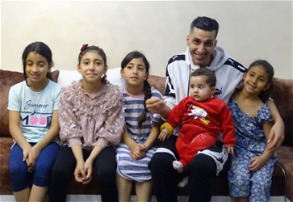 Rajabi with his five daughters at their home,  two days before demolition.